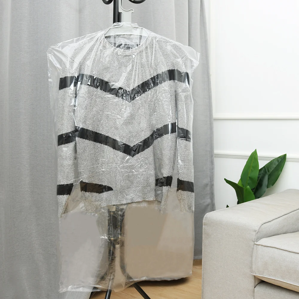 

OUNONA 50PCS 60x100cm Clothes Dust Cover Disposable Garment Dust Shield Garment Suit Bag