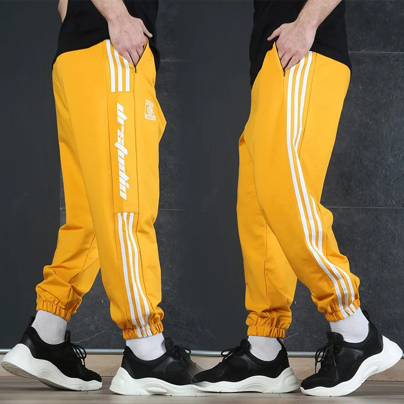 

New sports running men's pants slim fit stitching closure training small foot sweatpants fashion trend casual pants