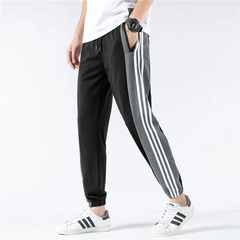 

2021 spring and autumn fashion trend large size thin men's loose sports youth drawstring solid color stretch casual pants