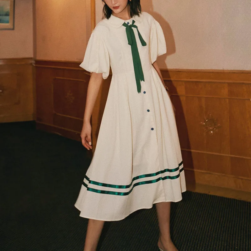 Возможно платье с пышными рукавами и бантом на пуговицах средней длины Цвет