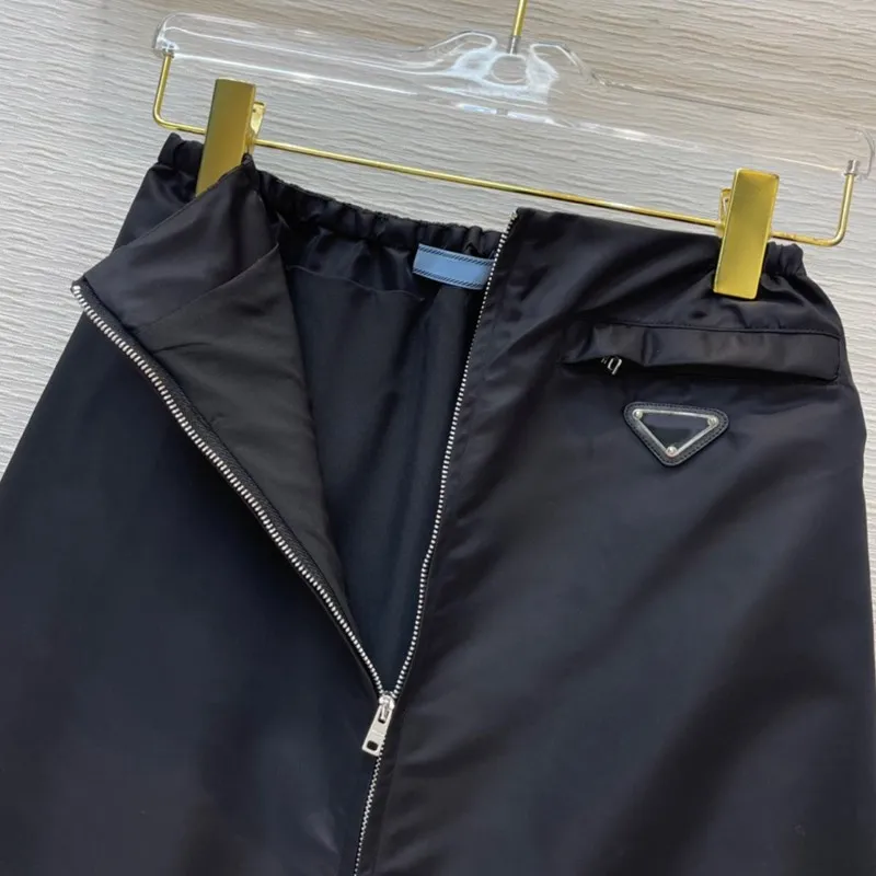 

2021 early spring new female skirt girly style wild thin package hip skirt mid-length split zipper elastic high waist skirt