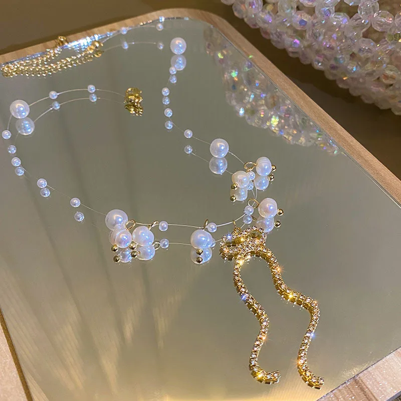 

Luxury New Trendy Elegant Pearl Bowknot Pendant Zircon Necklace For Women Chain Choker Necklace Bohemian Jewelry Gifts 2021