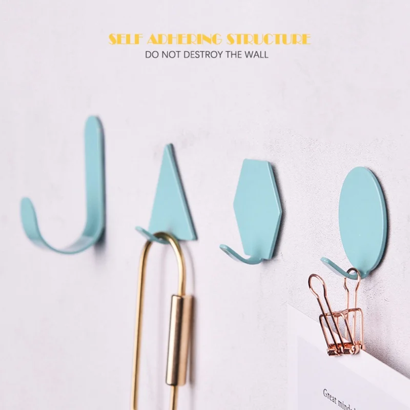 

4Pcs/lot Geometric Iron Hook Punch-free Wall Hanging Hooks Nordic Simple Slef-adhesive Hanger Household Storage Supplies