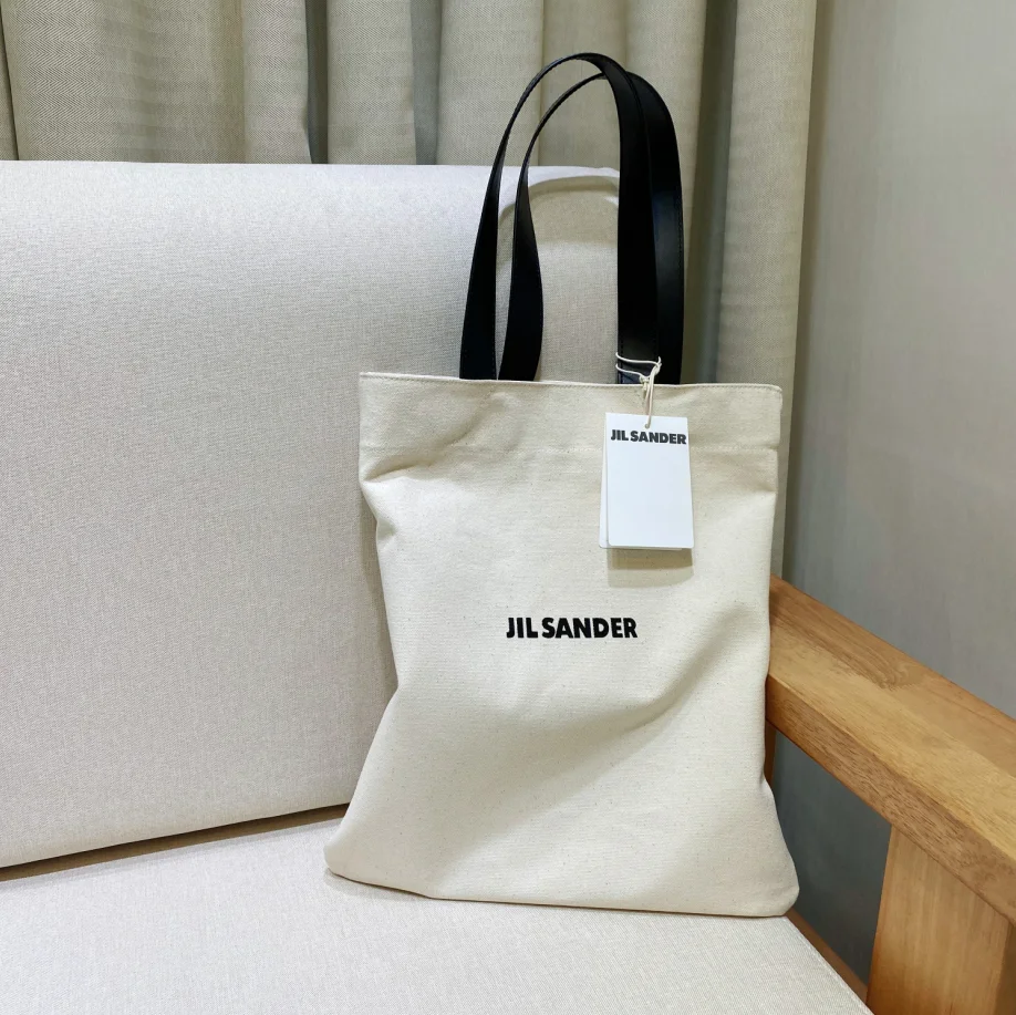 

2021 Niche design jil sander minimalist style Canvas Tote Shopping Bag Tote simplicity women's large dumpling bag bucket bag