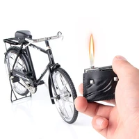 vintage mens and womens bicycles with leather bags creative desktop open flame realistic model lighter