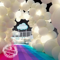 giant white balloon wedding arch decoration baby birthday party adult banquet room decorated with colorful macarone balloons