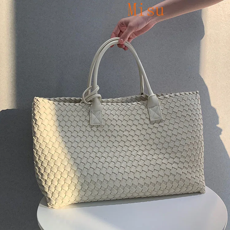 

2020 beach fashion double soft surface hand woven women's bag portable shoulder bag European and American mother's bag