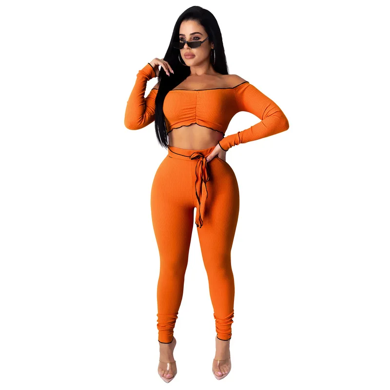 

Женский комплект из двух предметов с рюшами, укороченный топ с открытыми плечами и длинными рукавами, штаны с галстуком-бабочкой, элегантны...