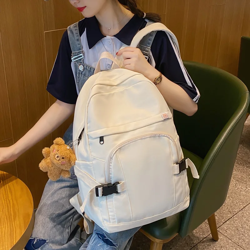 

Водонепроницаемый нейлоновый женский рюкзак DCIMOR, простая однотонная школьная сумка с застежкой-пряжкой и карманом для девушек и студентов