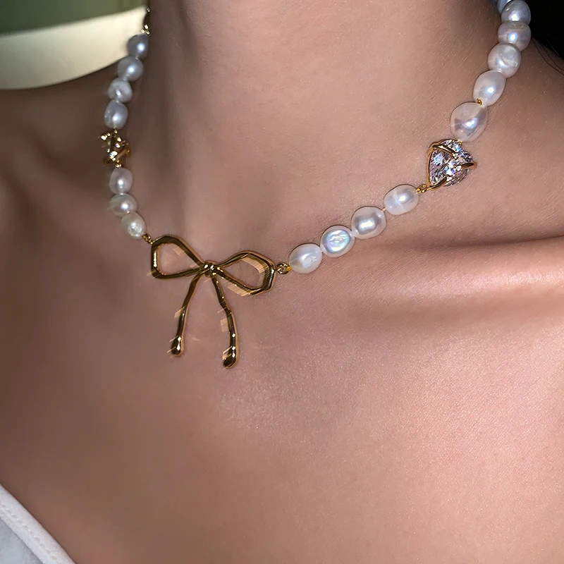 

Original designer Retro hollow bow earrings freshwater pearl collarbone necklace female