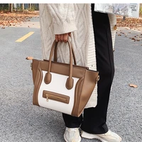 Large capacity bag for women autumn  winter 2020 new fashion and versatile cross arm portable smiling face wing bag
