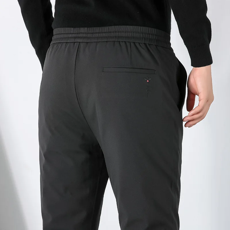 

youth Feather men's casual pants male winter elastic solid color down the tank with thick warm cold slacks
