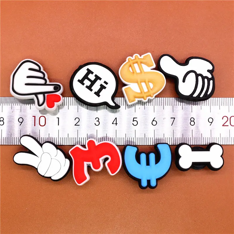 1pcs Shoe Charms Bone PVC Croc Accessories Decorations Dollar Euro Franc Sign Gesture JIBZ Charm Buckle for Kids Party Xmas Gift