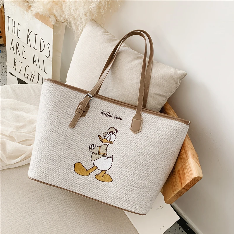 

New2021 Disney Cartoon white handbag Women's canvas bag Donald Duck Mickey large-capacity handbag kawaii top handle bags