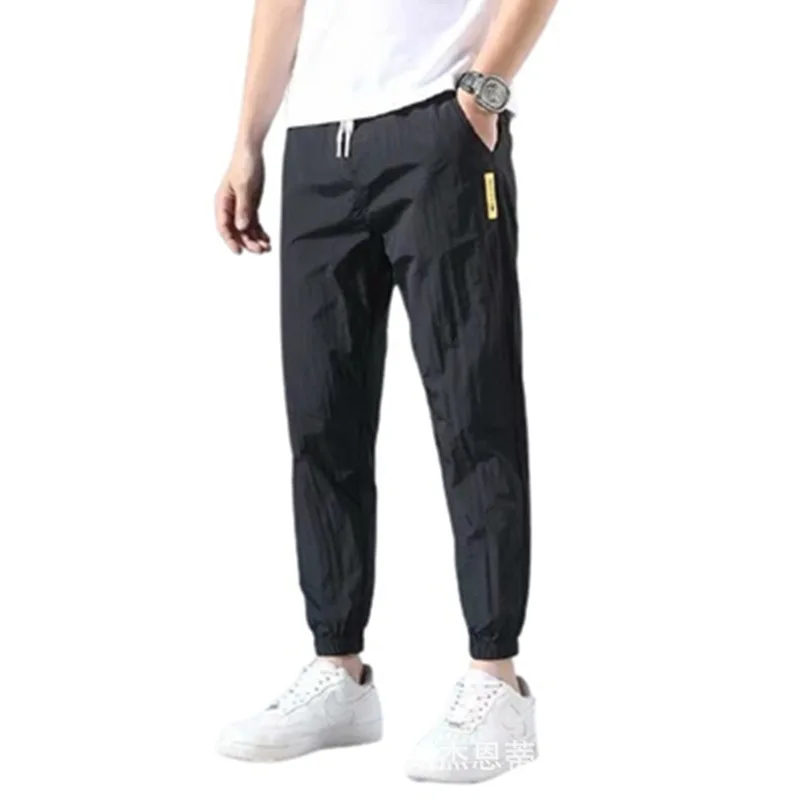 

Summer ice silk pants men's casual pants nine points casual trend loose sports thin section Korean version of Harlan trousers