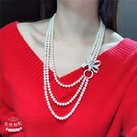 Hand knotted 3strands 7-8mm white freshwater pearl necklace bowknot micro inlay zircon accessories pearl pendant long 55-65 cm