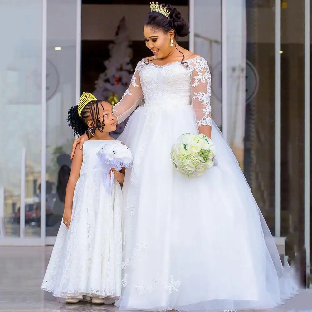 Скромное бальное платье свадебное с рукавами 3/4 украшенное бисером в африканском