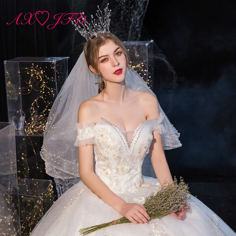 

AXJFU princess white lace wedding dress party vintage boat neck beading crystal illusion sexy sparkly white wedding dress
