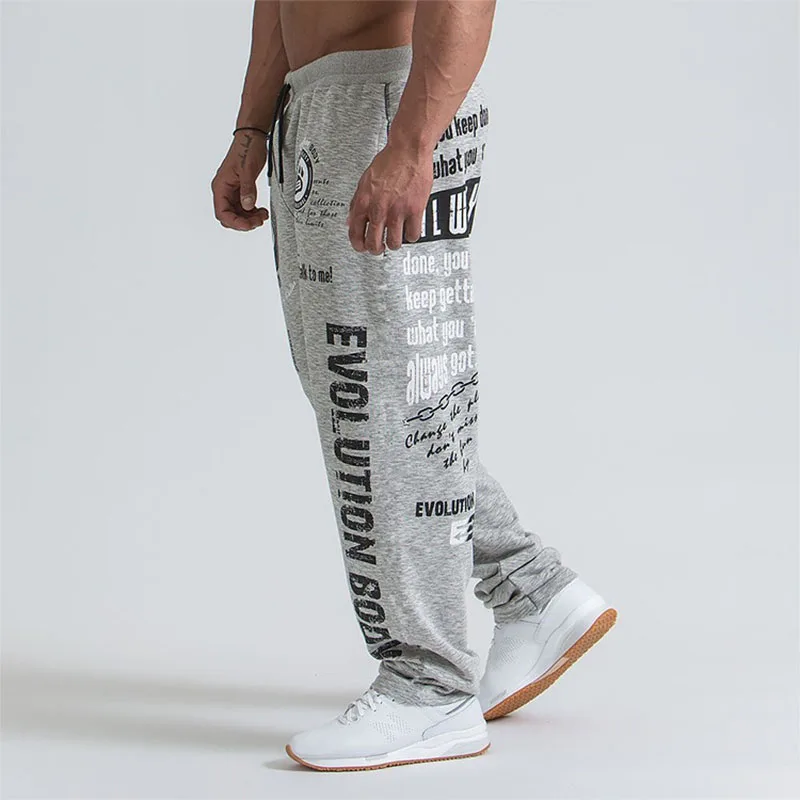 

2021 European And American Solid Color Loose Large Size Printing Casual Fitness Trousers Men's Running Training Sports Pants