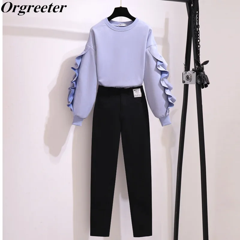 Женский брючный костюм на молнии с оборками и длинным рукавом |