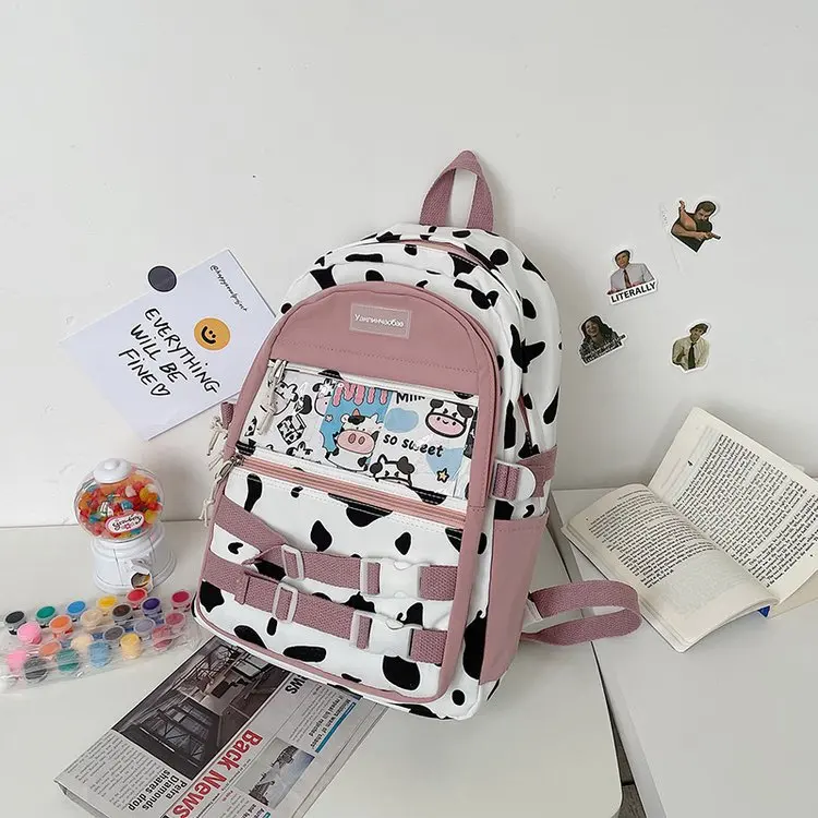 

2021 Japanese Cute, Cute and Funny Personality Backpack Hit Color Cow Dot Student School Bag Female Send Pendant