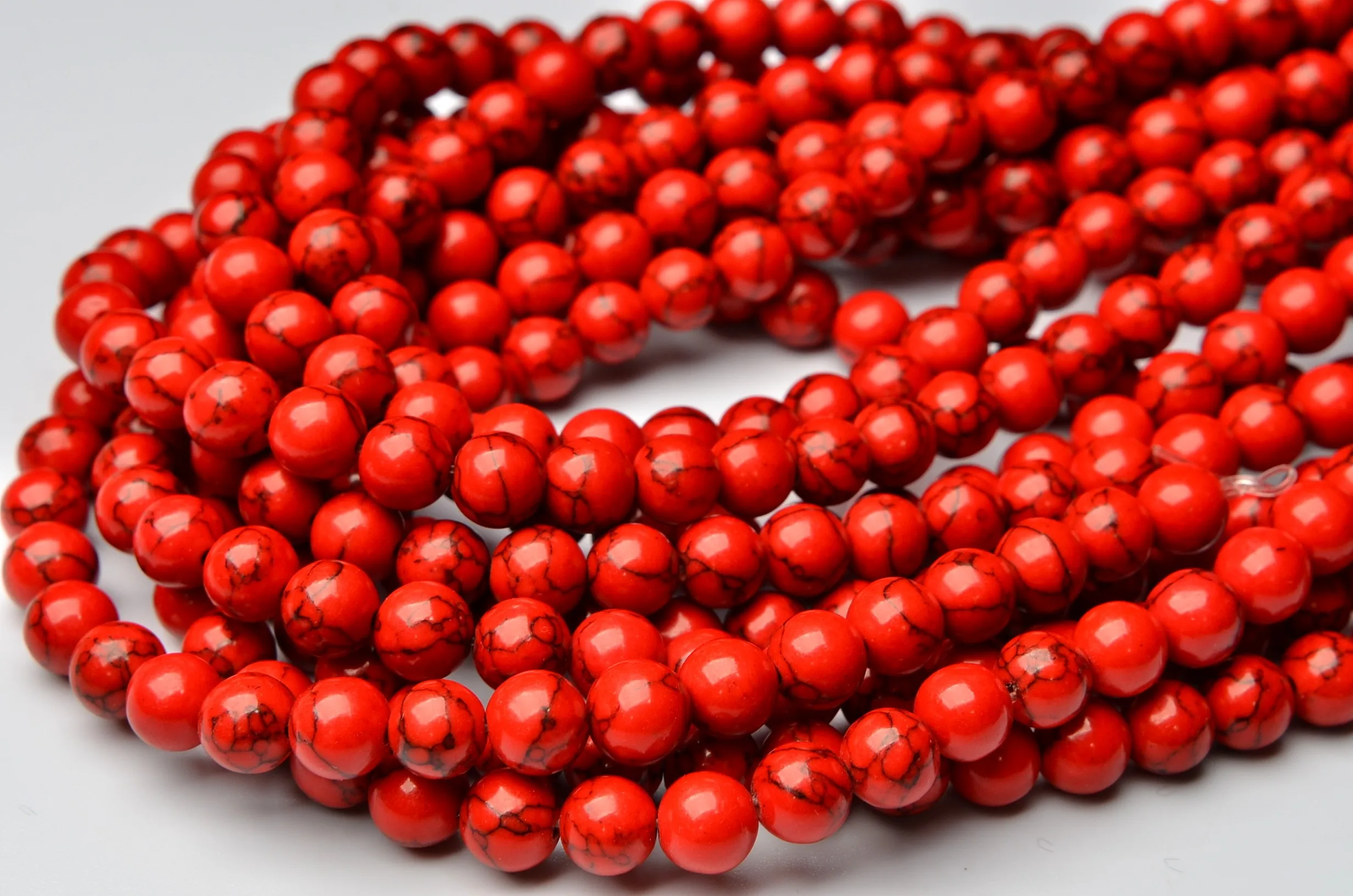 

Artificial red pine stone 4mm-14mm 1 strands/set (about 38cm)
