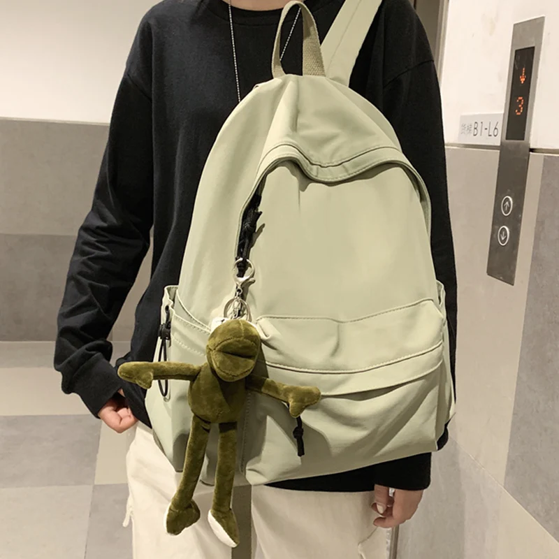 

2021 new products Both boys and girls Large capacity Backpack Korean Pure color Fashion Waterproof travelling bag Canvas bag