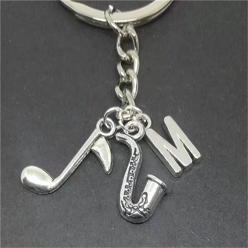 

Fashion Handmade Initial Keychain Antique Silver Color Jewelry Simple Music Note Saxophone Keychain