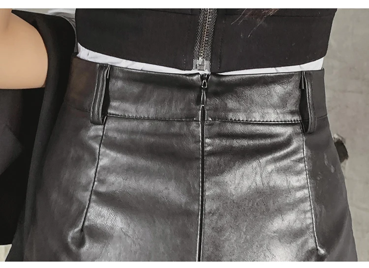 Женская юбка Jupe Femme B9D101 однотонная мини из искусственной кожи с заклепками весна