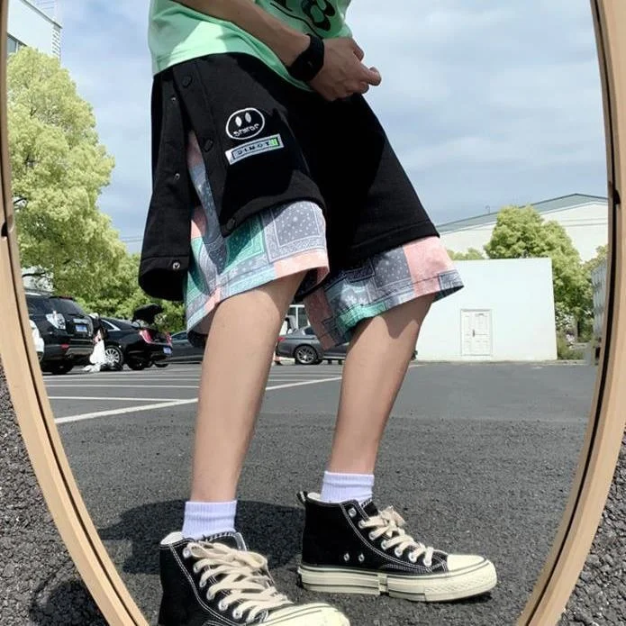 

Cashew blossom stitched shorts fake two-piece Japanese large loose sports Capri Pants button shorts men's fashion pants