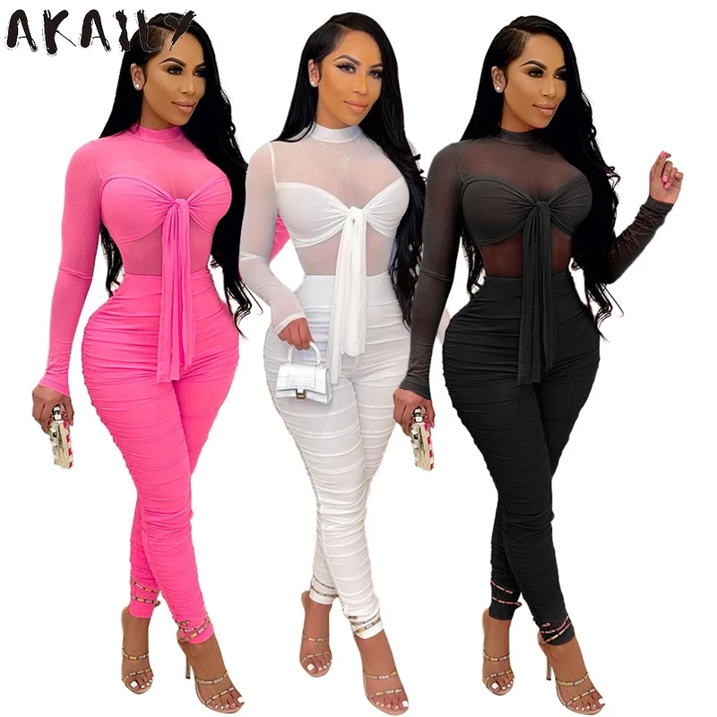 

Akaily Streetwear Solid Slim Bandage Jumpsuit Women Turtleneck See Through Ruched Romper Female Black Mesh Bodycon Jumpsuiy 2021