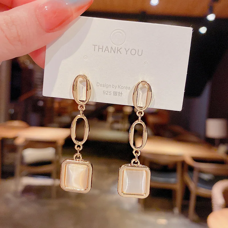 

Cat's eye stone earrings female fashion personality geometric temperament simple Earrings S925 silver needle Korean personalized