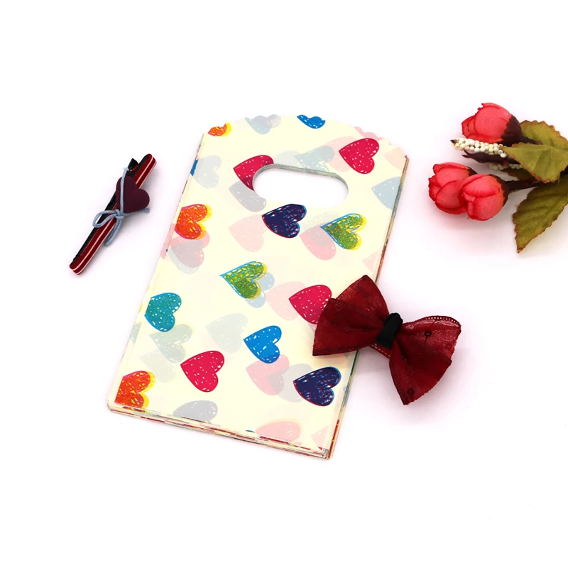 

9x15cm 50pcs/lot Plastic Jewelry Bags with Handle Mini Colorful Heart Printed Gifts Candy Soap Packaging Bags Handmade Pouches
