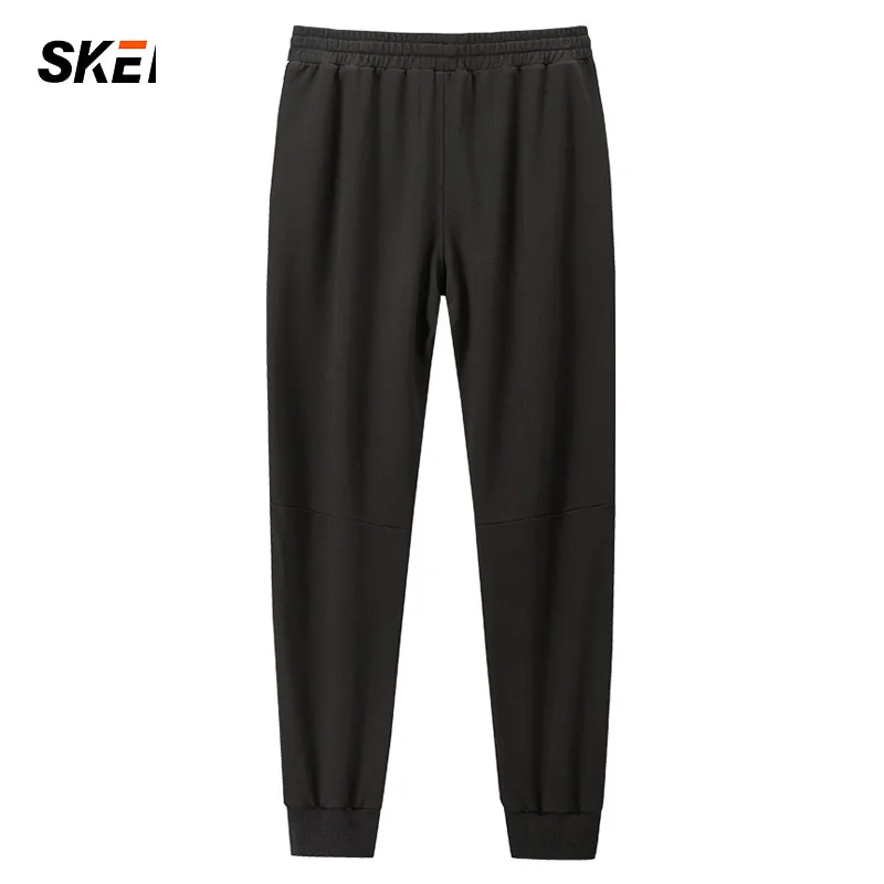 Леггинсы мужские спортивные с карманами эластичные свободные для бега 2021