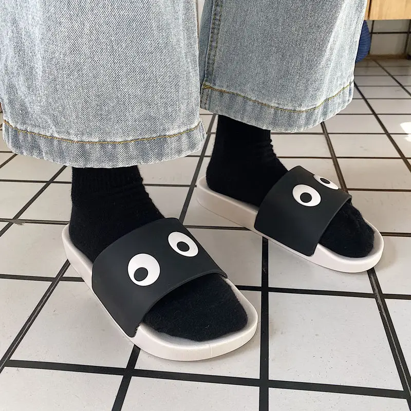 

WEH Men Slippers 2020 Summer Cute Eye Cartoon Men Slides Beach Shoes Male Flat Heels Flip Flops Indoor Room Slippers Rubber Sole