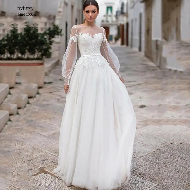 Свадебное платье в пол из тюля с открытой спиной а-силуэта пышными рукавами