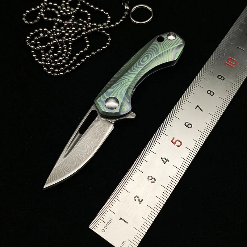 

Карманный складной мини-нож 3,7 см, лезвие из дамасской стали, полностью титановая ручка, шарикоподшипник, поворотная система, инструменты дл...
