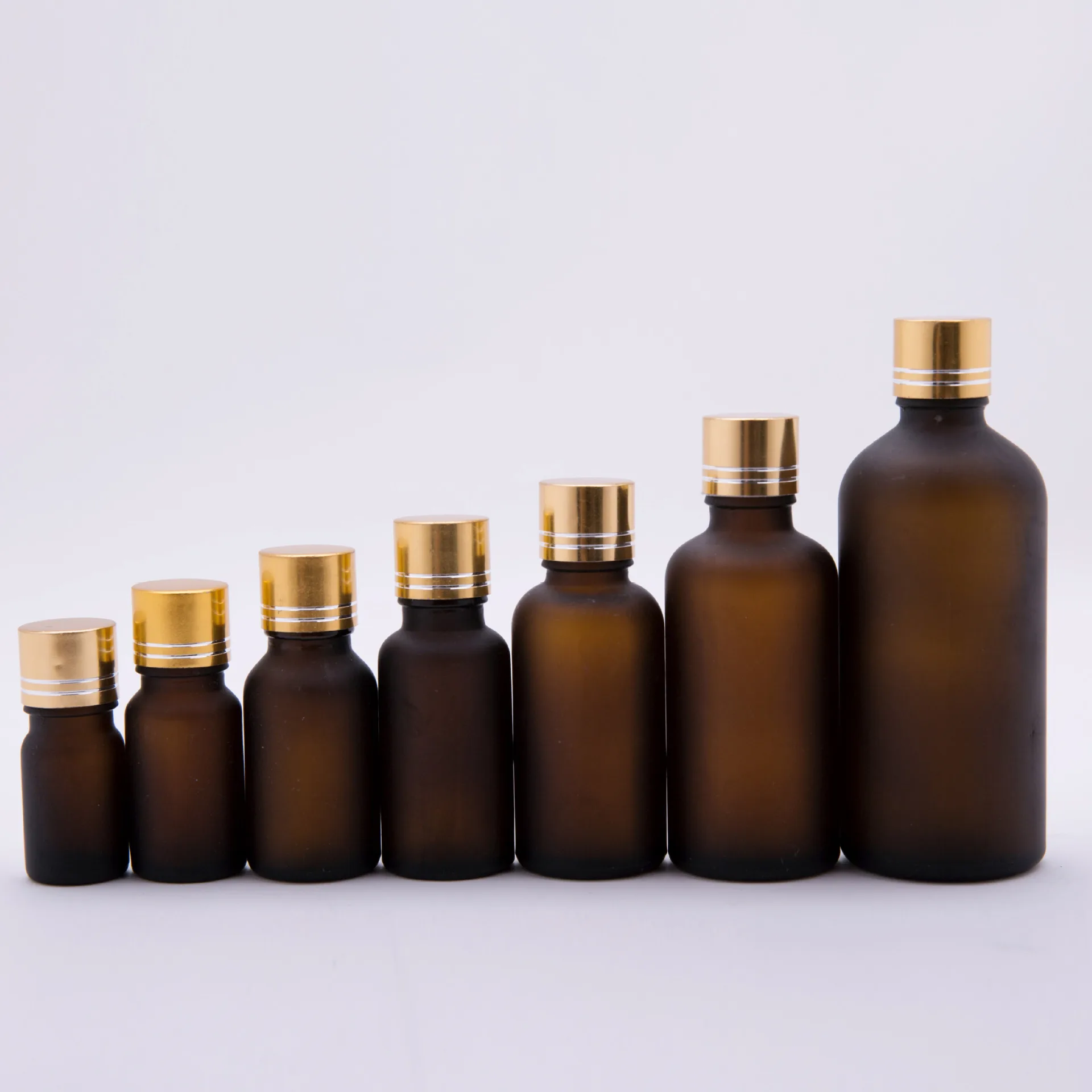 

5ml 10ml 15ml 20ml 30ml 50ml 100ml Thick Amber Essential Oil Glass Bottles With Gold Cap Glass Containers