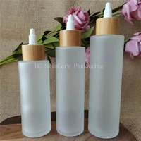 empty bottles cosmetic containers wholesale l3oz 4oz 5oz matte glass lotion spray pump bottle with luxury bamboo lid wood cap
