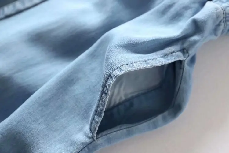 

Europe and The United States Women's New V-neck Rope Wire Tencel Denim Sling Jumpsuit