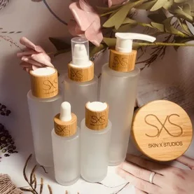 

Hot sale Custom logo100ml 120ml 150ml Glass Bottle with bamboo Lid Empty Lotion/Toner Container Liquid Packaging Container