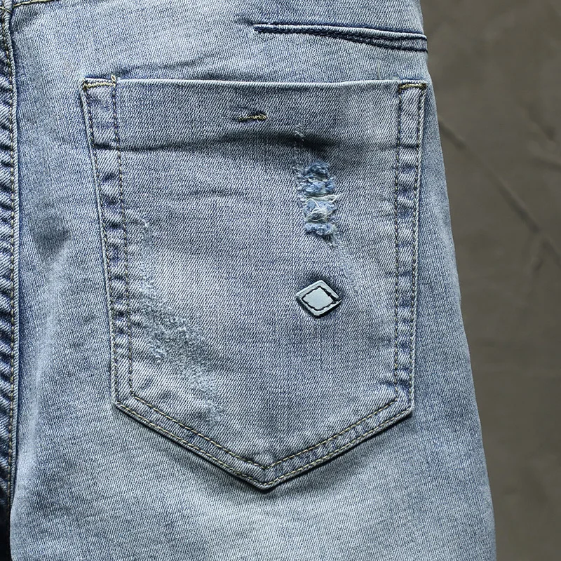 Джинсы мужские рваные узкие Брендовые брюки из денима стрейч светло-голубого