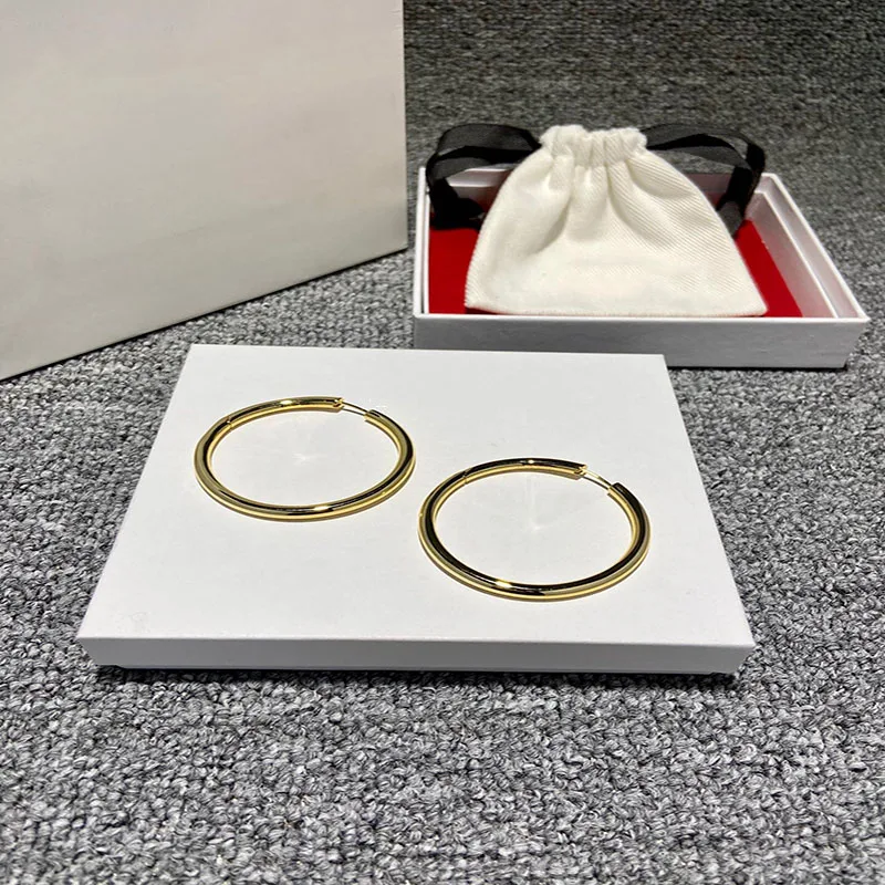 

Women's luxury brand S925 sterling silver golden round earrings original simple temperament fashion boutique gifts