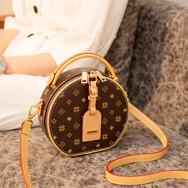 

Женская круглая сумка из натуральной кожи, с ручками и плечевым ремнём