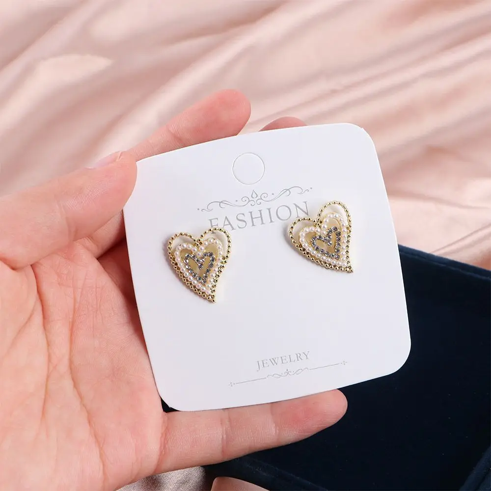 

Женские серьги-гвоздики в форме сердца, из сплава