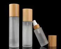 eco friendly cosmetic packaging 120ml 100ml 150ml frosted bamboo pump bottles and jar with bamboo top natural wooden lids