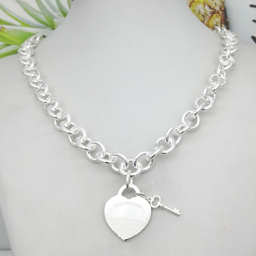 

Classic fashion boutique heart-shaped double color wheel key tags, necklace