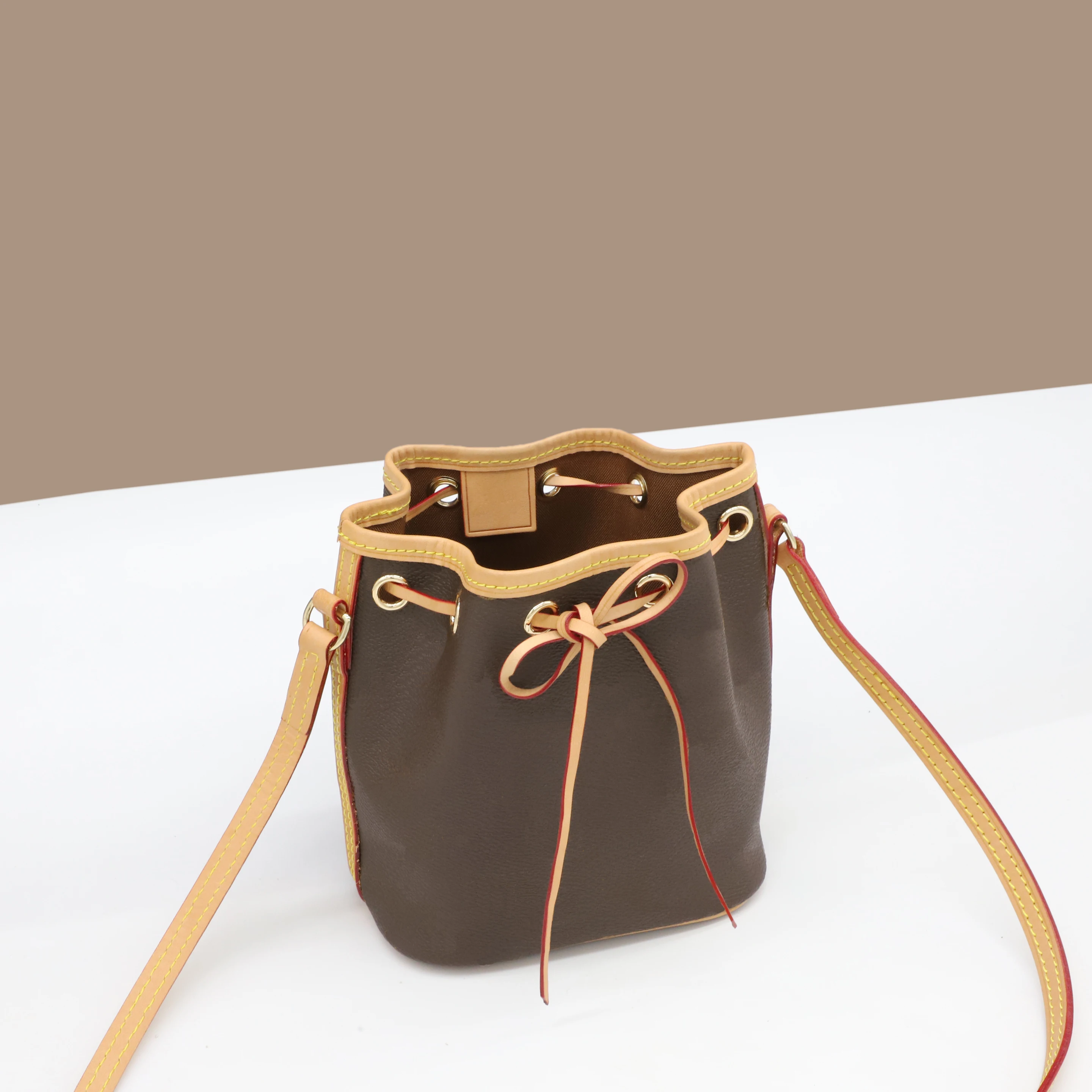 

Высококачественная классическая роскошная дизайнерская мини-сумка-мешок с узлом и лентой из 100% натуральной кожи, сумка-мессенджер с открыт...