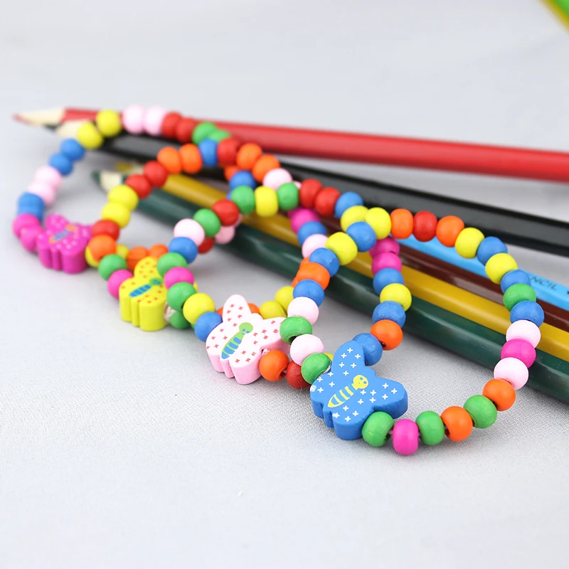 

Free shipping, 20 pieces / batch, children's wooden candy color bracelet, bulk birthday gift / toy, little princess accessories