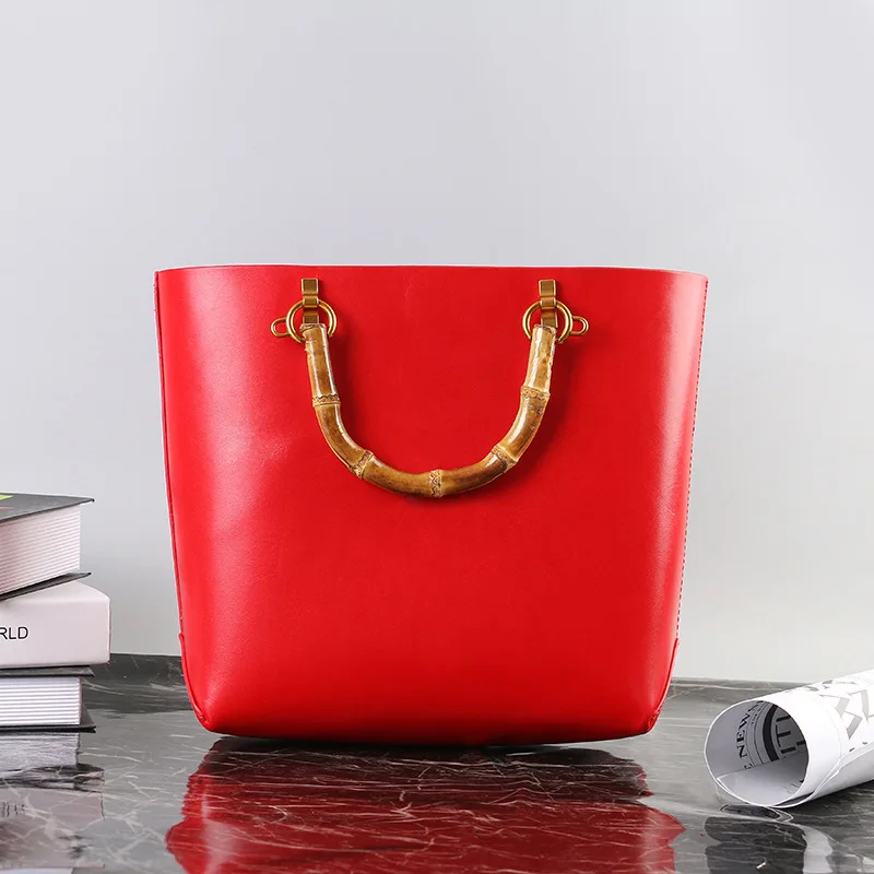 

Xinxueer 2020 fashion new products bamboo handle leather handbag case leather goods